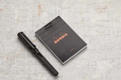Rhodia No. 11 A7 Notepad - Black, Lined -Writing Tools Store Rhodia ClassicNotepad TopBound A4 No11 Stapled Lined Black 1